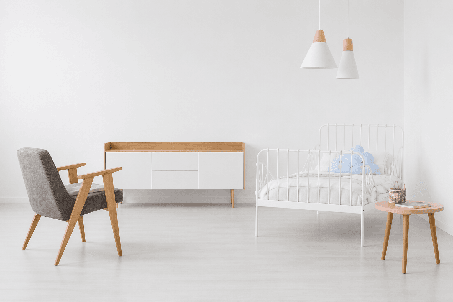 A bright Scandinavian room with a bare wall
